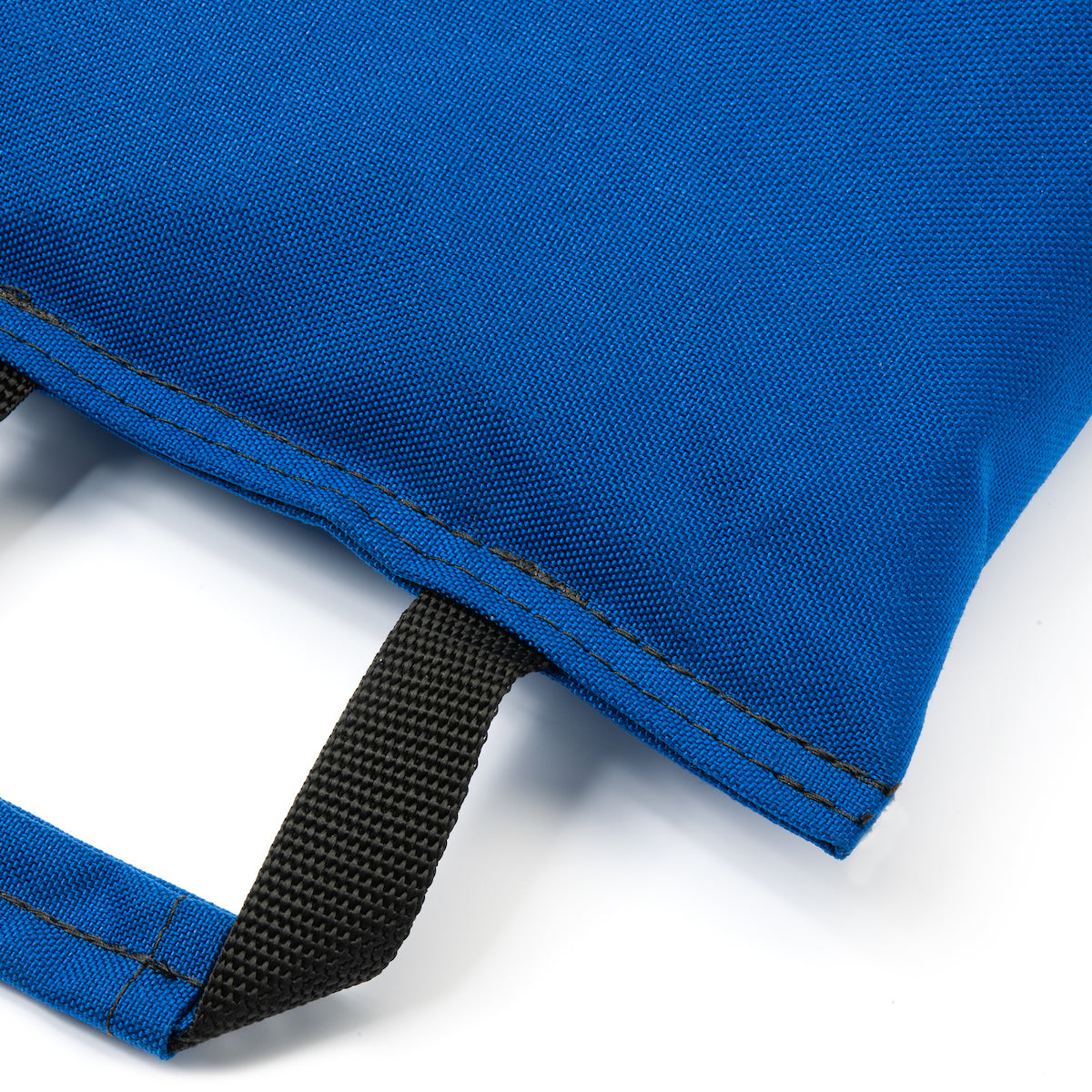 Close-up of a blue  dual handled sandbag with a black strap on a white background