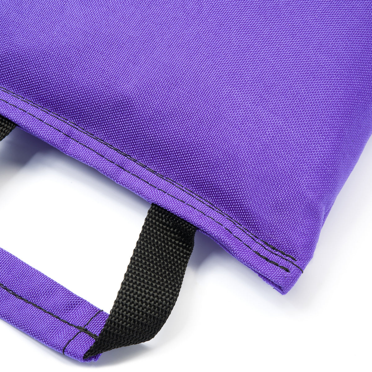 Close-up of a purple dual handled sandbag with a black strap on a white background