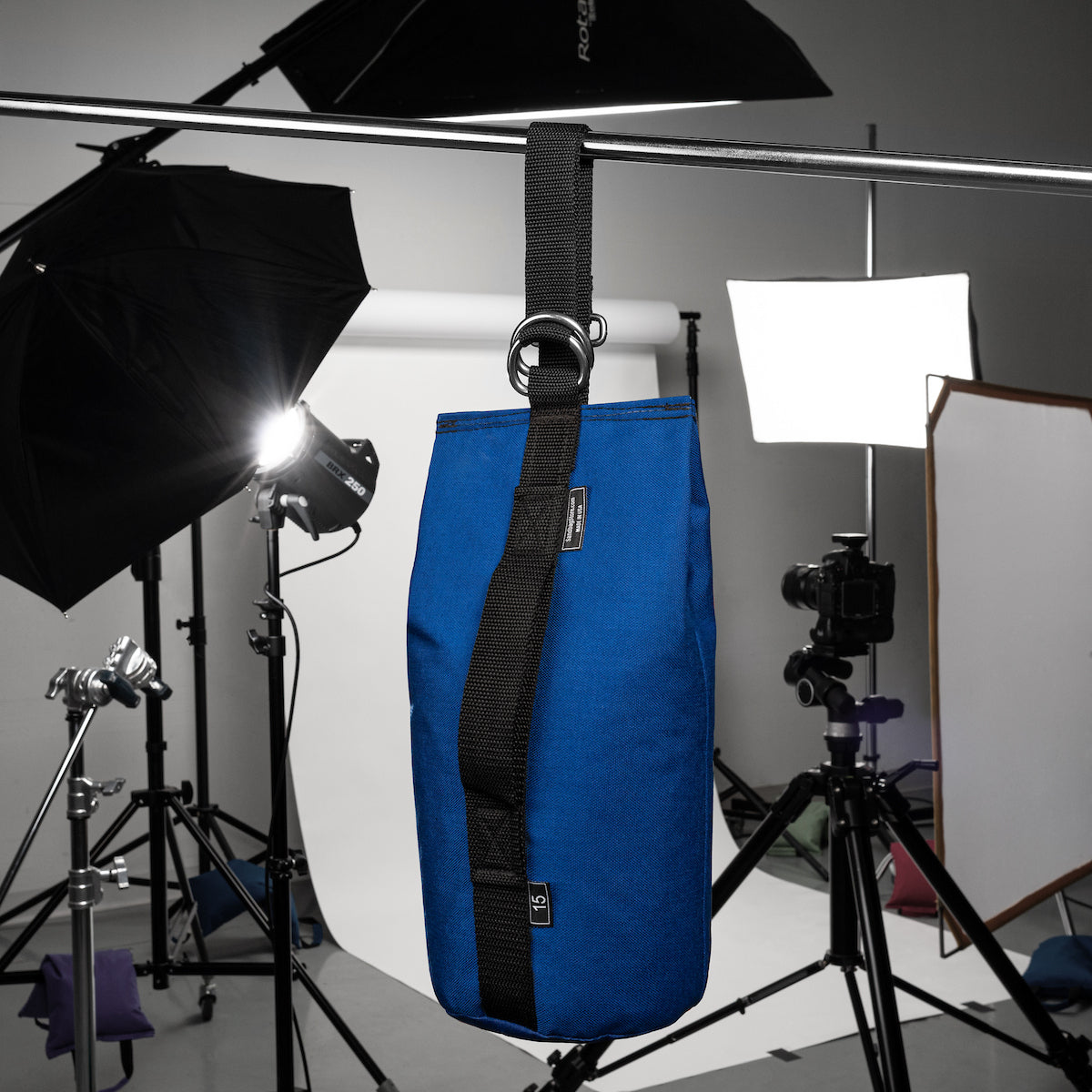 Blue bag with a strap in a photography studio setup