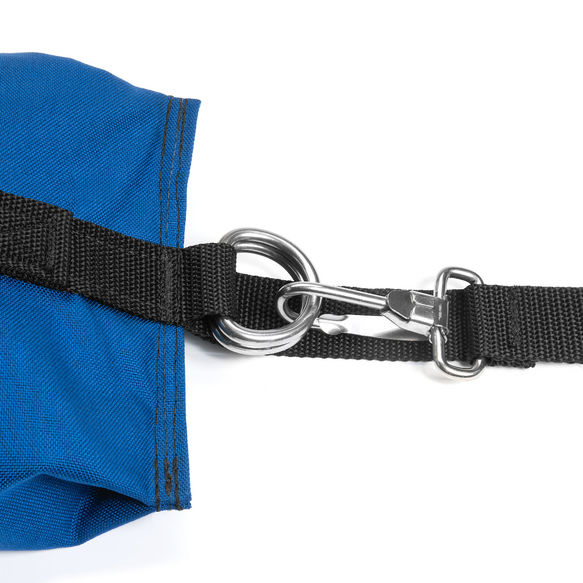 Close-up of a blue fabric with a black strap and metal clasp on a white background