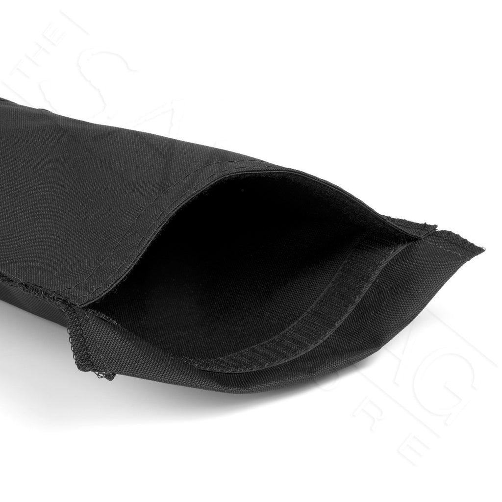 Black tube sandbag with the opening shown, a velcro fastener keeps the bag closed once full , shown on a white background