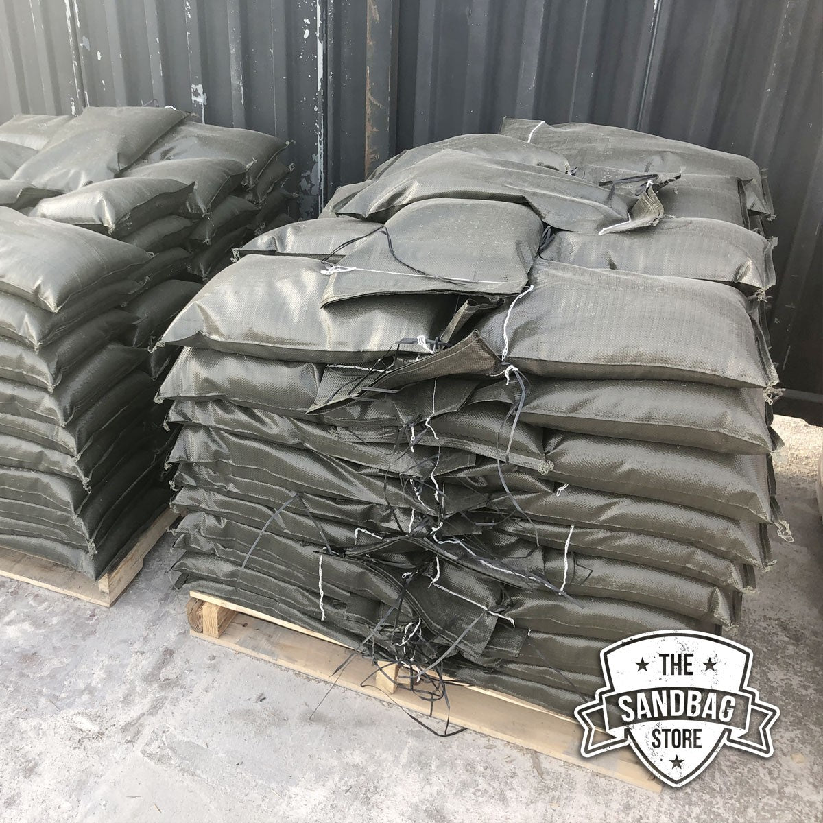 Cactus sandbags in green color filled and stacked on a wood pallet