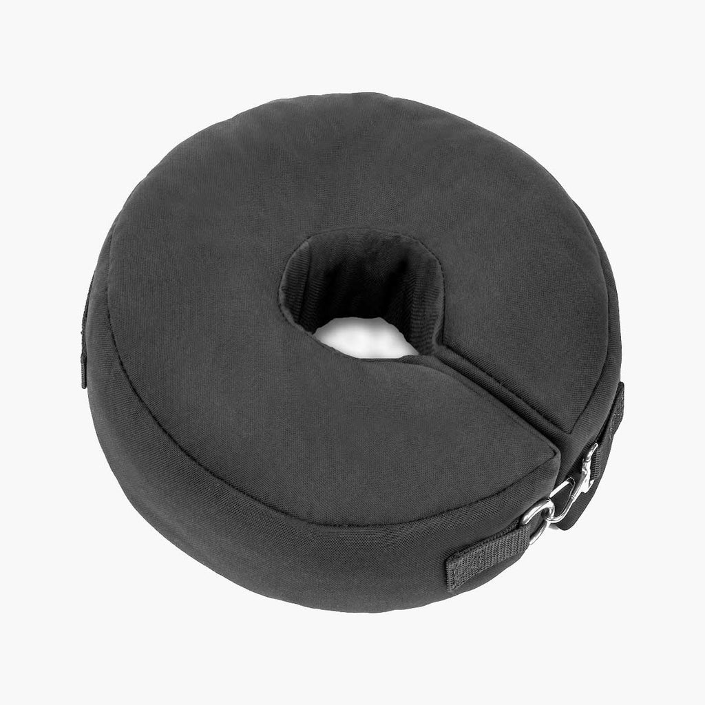 Black 25 lb circular sandbag with steel clasp and center hole on white background
