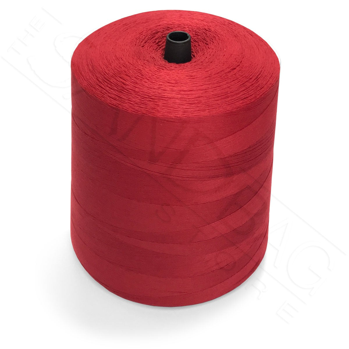 Spool of red thread for closing sandbags on a white background