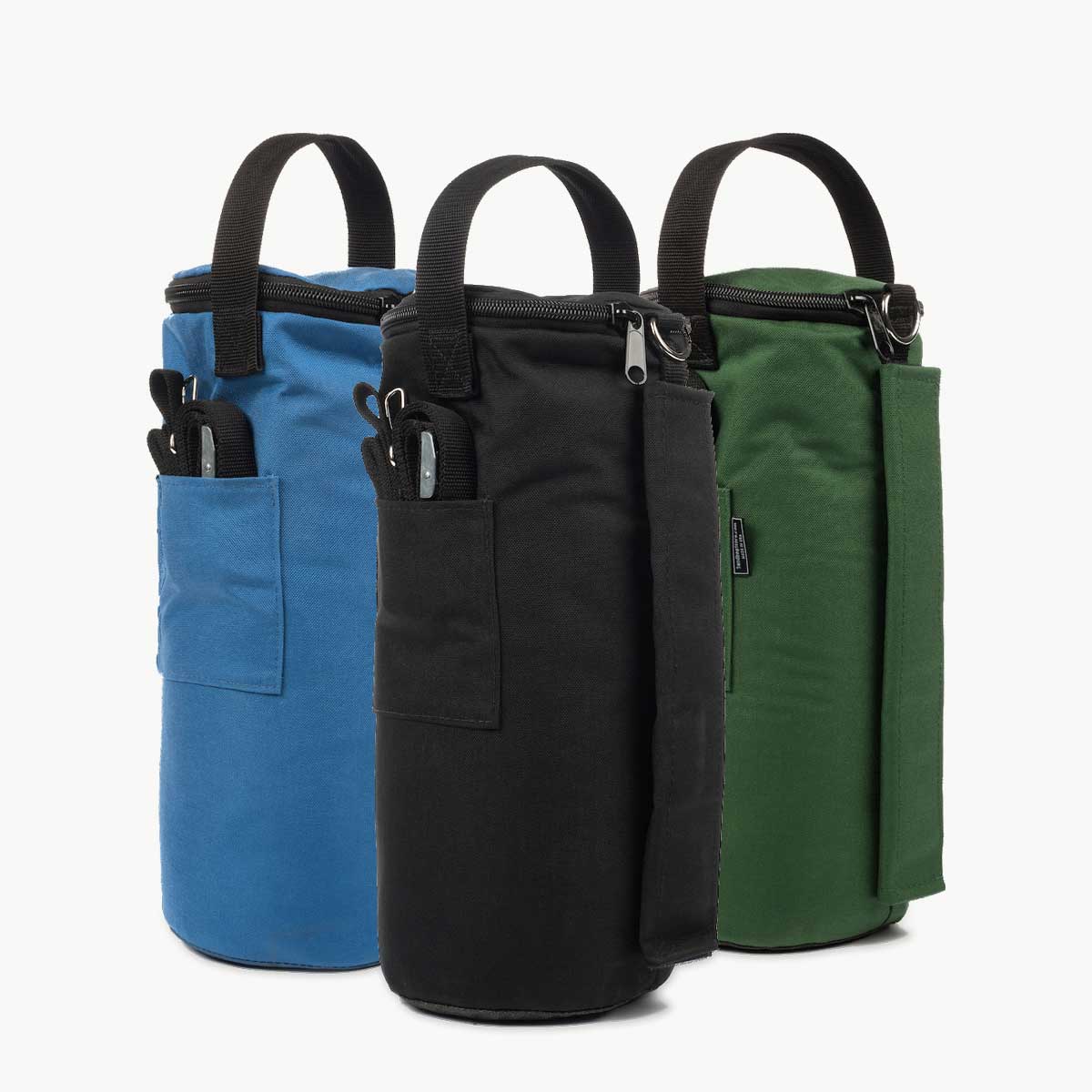 Three Apex Tent Weight sandbags in blue, black, and green on a white background