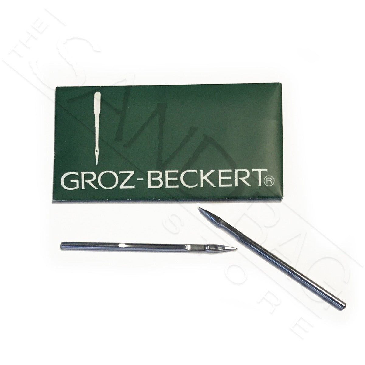 Pack of 10 needles for sandbag sewing head in green pack with two needles resting on white backdrop