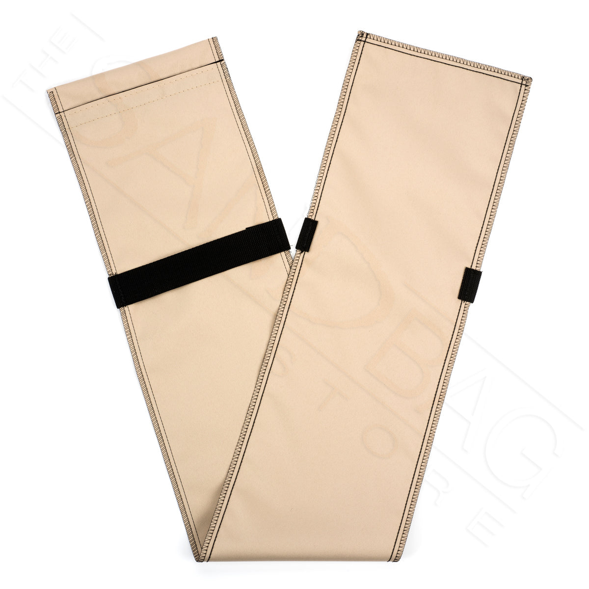 tan tube sandbag folded in half with black handles on a white background
